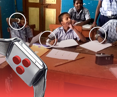 RHEMA team demonstrating tactile technology in a classroom